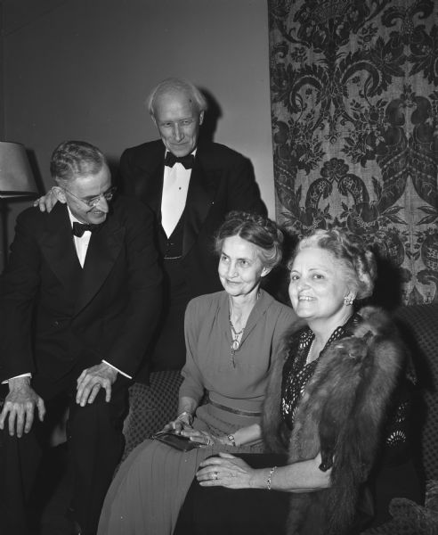 Left to right are: Professor Andrew T. Weaver, Professor William Kiekhofer, Gladys Kiekhofer, and Cornelia Weaver, audience members at the premiere production of the Alfred Lunt-Lynn Fontanne play "I know My Love" at the Wisconsin Union Theater.