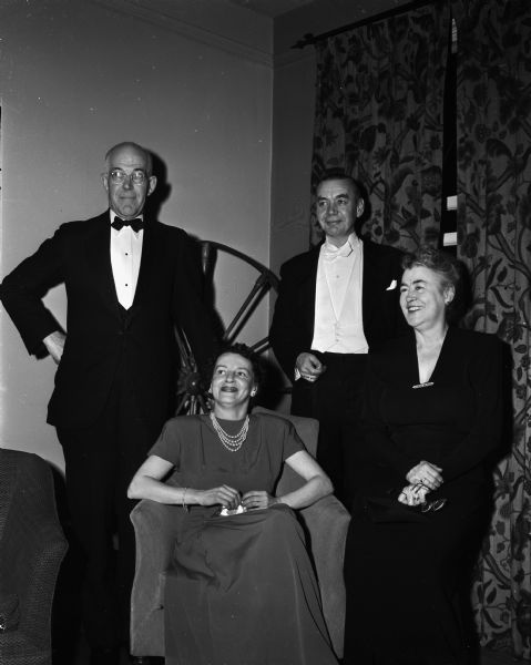 Left to right are: Arlie W. Schorger; Mrs. John Greene, sister of Alfred Lunt; Mr. John Greene; and Margaret Schorger; audience members at the premiere performance of the Alfred Lunt-Lynn Fontanne play "I know My Love" at the Wisconsin Union Theater.