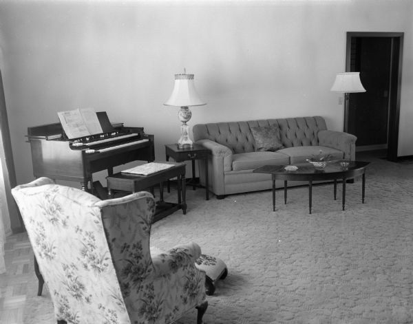 The twenty-by-thirty-foot living room in the Westye F. Bakke home at 4818 Odana Road (now 4817 Sherwood Road). There is a piano in the left corner in the background.