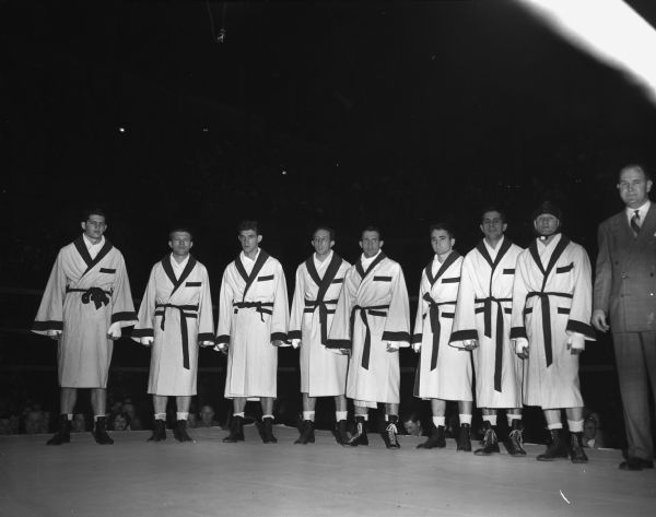 Members of the University of Wisconsin boxing team standing in the ring.
