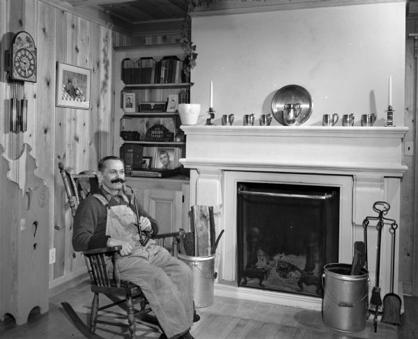 Ernest Thierstein relaxing in his Swiss-style chalet home in New Glarus. He came from the village of Boviel in the Emmental valley in the canton of Bern, Switzerland.