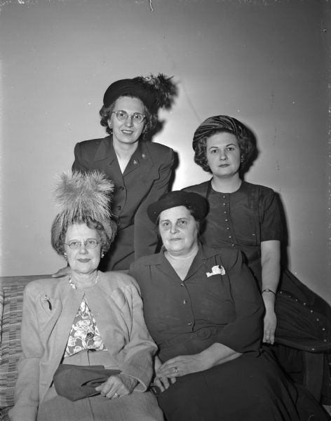 The first officers of the newly-organized women's auxiliary to the West Side Business Men's Association are shown. In the front row are: Mrs. Evelyn Woolsey, vice-president, and Mrs. Marie Philips, president. In the back row are: Mrs. Vincie E. Di Salvo, recording secretary, and Mrs. LaVerne M. Hart, financial secretary.