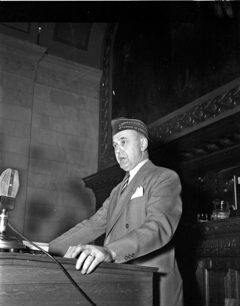 Lyall T. Beggs, former legislator from Madison and presently national commander of the Veterans of Foreign Wars, at the speaker's rostrum in the state assembly chambers speaking to his former colleagues concerning veterans legislation.