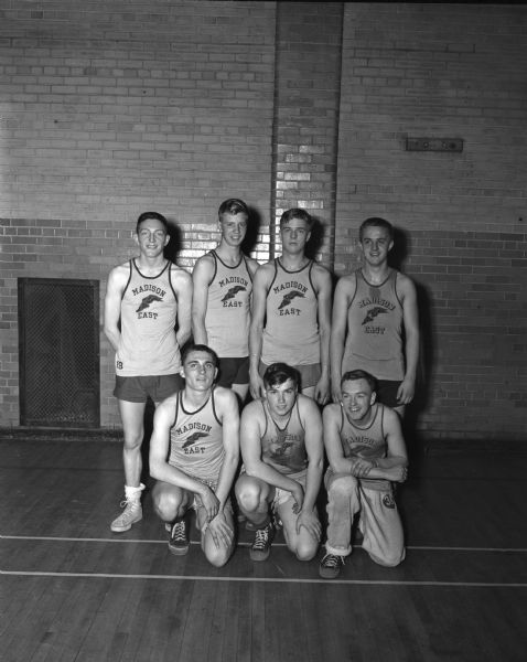 East High School Cardinal recreational basketball team wins the Four Lakes League Tournament. They defeated the Central '49ers, 28-23. The players are, left to right, front: Richard Olsen, George "Bud" Otis, and Danny Crawford; back: Ted Payne, Ray Spaanem, Dan Peterson, and Frank Hanson.