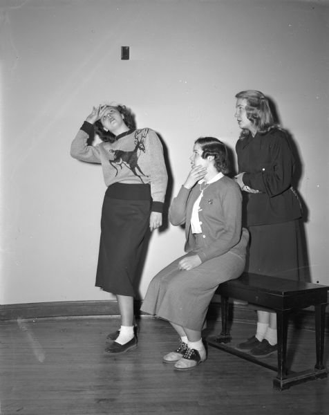 Shirley Roll, Jane Spencer and Patricia Runstrom, rehearsing the roles of three old maids in East High School's spring play, "Tish".