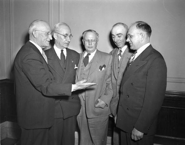 Members of the Izaak Walton League presenting the member-at-large award to Fred Luening of Milwaukee for his work in conservation. In the photograph are, left to right: Bill Cook of the Stevens Point chapter, presenting the award; Luening; A.D. Sutherland, Fond du Lac, state league president; Harry Klemme, Kiel; and Burton Lange, Horicon, state director.