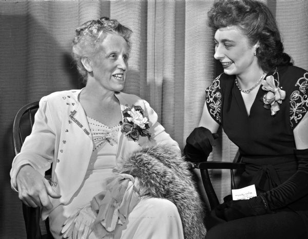 Sigrid Schultz, foreign correspondent and speaker at the annual Matrix banquet sponsored by the University of Wisconsin chapter of Theta Sigma Phi at the Memorial Union, is shown at left, chatting with Virginia Papenfuss, La Crosse, president of the professional jounalism society. More than 500 women attended the dinner event. The theme of her speech was that more sense and less sentimentality is what American needs at this point in her all out efforts to help secure world peace. Miss Schultz was director of the <I>Chicago Tribune's</I> Central European bureau in Berlin, and served as Berlin commentator for the Mutual Broadcasting System from 1938 to 1941. In 1945 she was war correspondent in the European theater and was with the first American detail to enter Berlin.