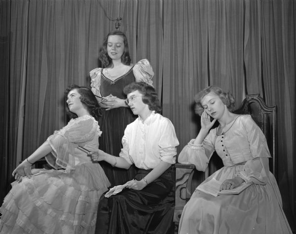 Cast members of the 19th century Mexican play "A Ninguna de Las Tres" by Frenando Calderon to be presented at the Memorial Union Play Circle as part of the university's Latin American Week. Pictured left to right: Marilyn Carbon; Alice Tridle (standing); Barbara Carlson, and Patricia Esterl.
