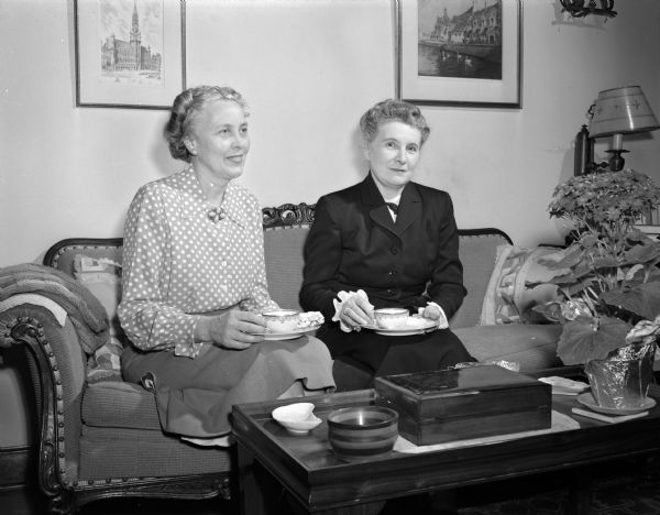 Mrs. B.I. (Rose) Peterson and Mrs. P.H. (Celestine) Hyland having a cup of coffee at the Peterson home. Both women are members of the 1949 Madison Community Chest budget committee; Mrs. Peterson represents the Bethel Lutheran church council and Mrs. Hyland is past president of the Catholic Women's Club.