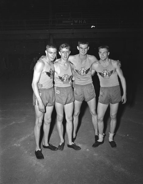 Jack Mansfield, Harlow Roby, Ronald Houser, and Jack Barry, Madison West, won first place in a relay event, helping Madison West to win the title.