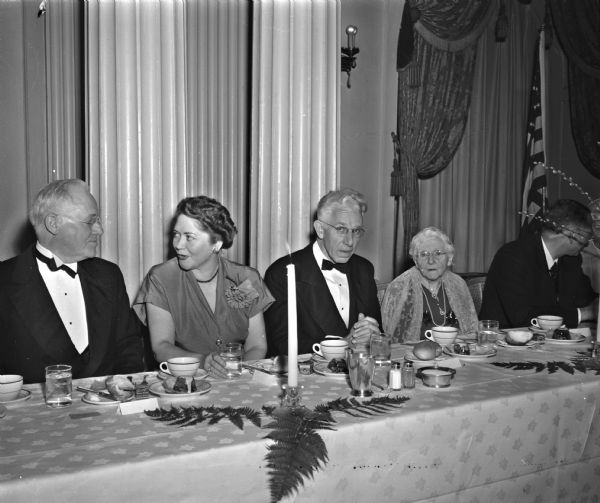 People seated at the head table at the Mississippi Valley Historical Association dinner at the Hotel Loraine. From left are Dr. Paul Knaplund, professor of history at the University of Wisconsin; Mrs. Ray Billington, Evanston, Illinois; Dr. Wendell H. Stephenson, Tulane; and Mrs. Frederick Jackson Turner, widow of the University of Wisconsin historian.