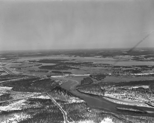 Aerial view of Petenwell Dam and dike on Wisconsin River twenty miles north of Necedah, Wisconsin showing the early formation of Lake Petenwell.