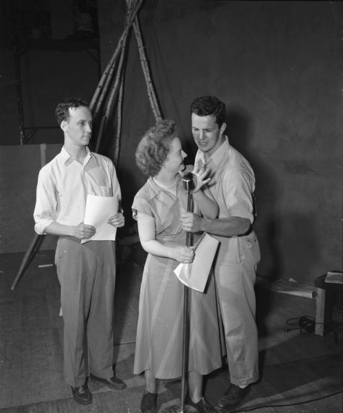 Rehearsing for the Wisconsin Players production of "Bite the Dust" are left to right: Irving Kreutz as Six-Killer Onehorse; Patricia McKeene as Polly Pearson; and Charles Webster asd John Onehorse. The play will be presented at the Wisconsin Union Theater.