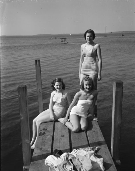 Pictured on the shores of Lake Mendota are (left to right): Mary Jane Bray, a junior from Baraboo; Margaret A. Van Wagenen, a freshman from Wauwatosa, and Carol S. Allen, a freshman from Princeton, Ill. They are enduring a 90 degree heat wave.