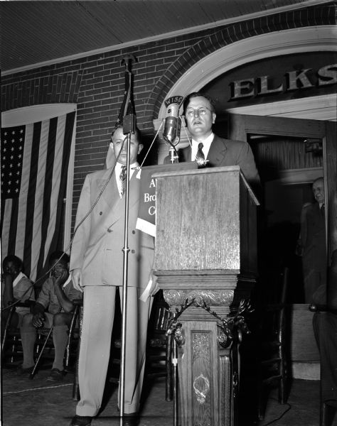 Attorney General Thomas E. Fairchild gives the keynote address at the flag day ceremony at the Madison Elks Lodge, 120 Monona Drive. At the left is Kenneth F. Sullivan, exalted ruler of the lodge.