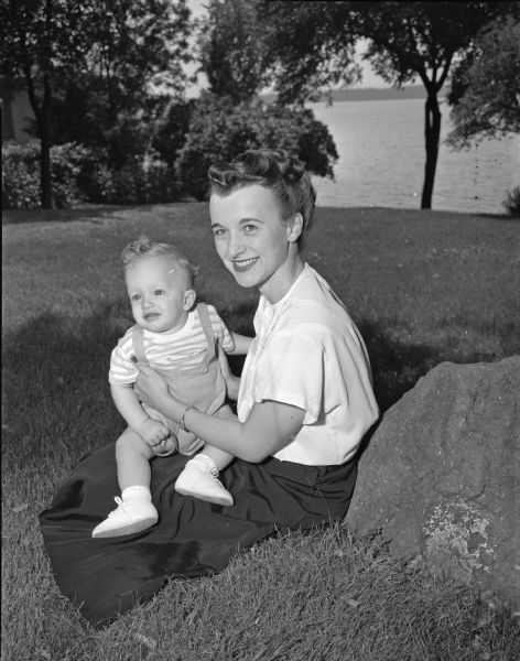 Pictured in the home of her parents, Mr. And Mrs. Norman Wang, 1225 Rutledge Street, are Mrs. Delmar (Dorothy) Brown Jr., and her nine month old son, Delmar III. The Browns are visiting from their home in Pittsburgh, Pennsylvania.