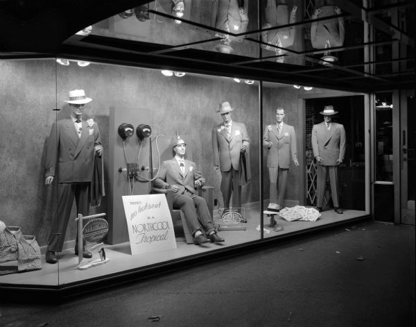 Display window of Rundell's Inc., a men's clothing store, 15 East Main Street, featuring "Northcool Tropical" suits.