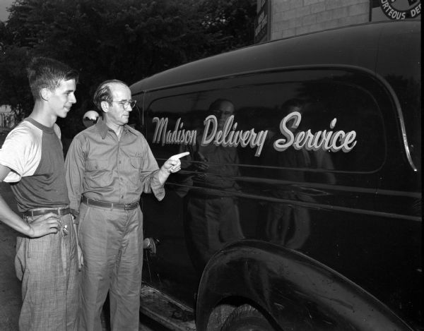 Don Jean Goodwin (left), who is a racer in the Soap Box Derby, with his sponsor, Sol Epstein from Madison Delivery Service.