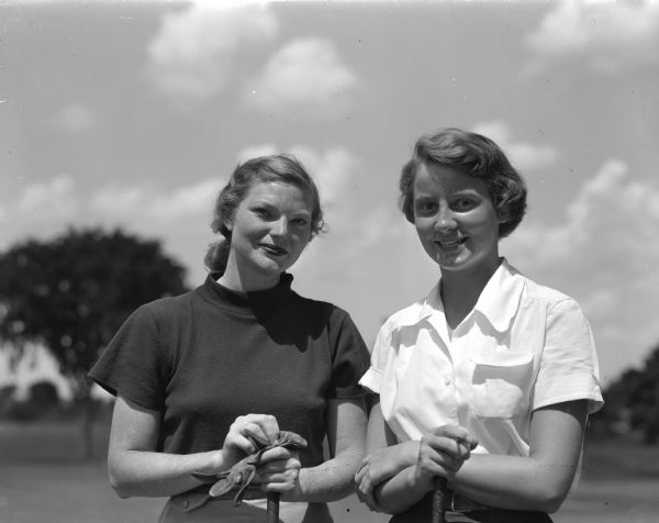Joan Coffeen (left) and Judy Conley of Green Bay won the positions of senior runner-up and junior runner-up respectively in the 1948 Wisconsin Women's Golf Association tournament.  The 1949 golf tournament is being held at Maple Bluff Country Club where the women were photographed.