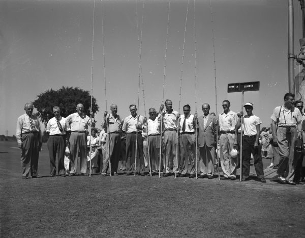 John St. John, left, is shown with his crew of marshals who handled a record-breaking gallery during the championship round of the Wisconsin Women's Golf Association Tournament held at the Maple Bluff Country Club.