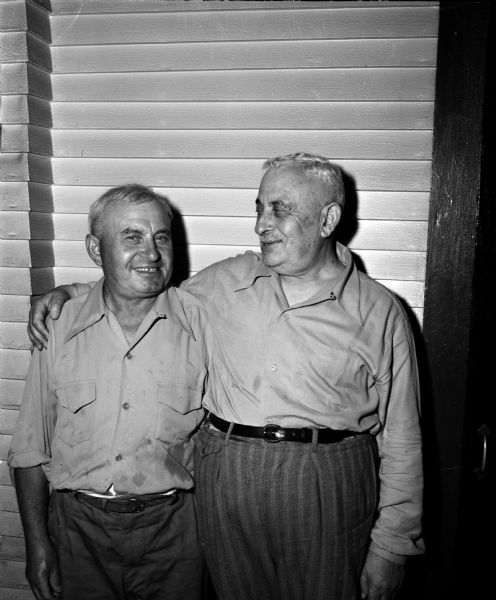 Brothers Sam Pollock, 107 South Mills Street, left, and Isaac Gersowsky, South Africa, enjoy their first visit after 24 years. They left Russia in 1901 to flee from persecution.