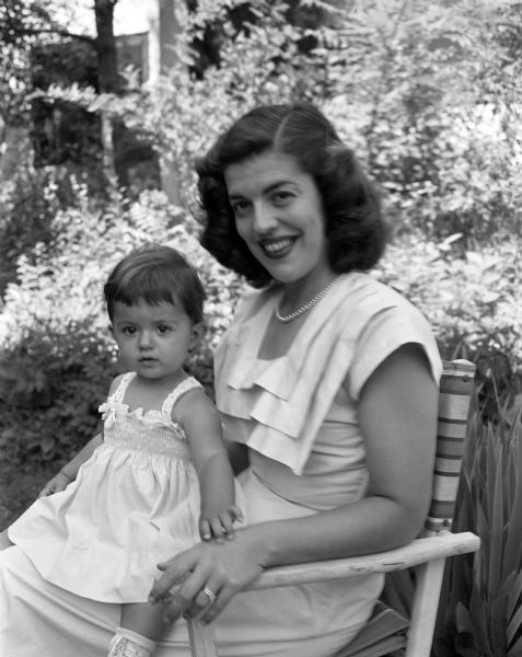 Portrait of Mrs. Thomas (Constance) Rockett and her one-year old daughter, Tracy, who are spending a month at the home of her parents, Mr. and Mrs. Herman N. (Constance) Legreid, 2306 Eton Ridge. The Rocketts are visiting from Mohegan Lake, New York.
