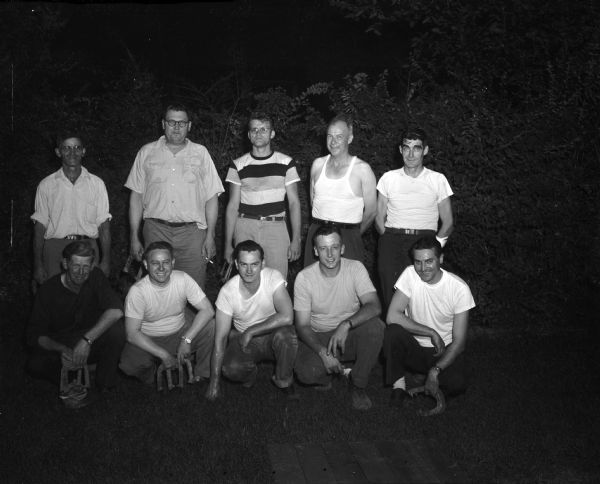 Group portrait of ten of Madison's horseshoe pitchers who competed in the All Stars municipal horseshoe league challenge match at Brittingham Park where the Felton Cubs defeated the Tesar-Ryan team. Players in the top row are from the Felton Cubs team, and those in the bottom row are members of the Tesar-Ryan team.