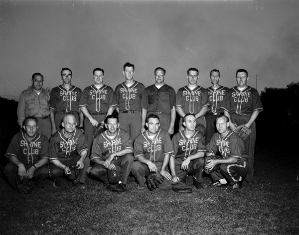 Group portrait of the Zor Shrine Club softball team in uniform, winners of the annual charity ball game at Breese Stevens Field. 
Back row, left to right: Coach Matt "Sonny Groth, Hal Metzen, Don Cowan, Manager Lyle Andrews, Judge George Kroncke, Jr., Paul Knabe, Del Hauser, and Ted Rundell. Front row: Earl Epstein, Les Ogilvie, Hal Richter, Hal Lauz, George Cnare, and Lloyd Kohl.