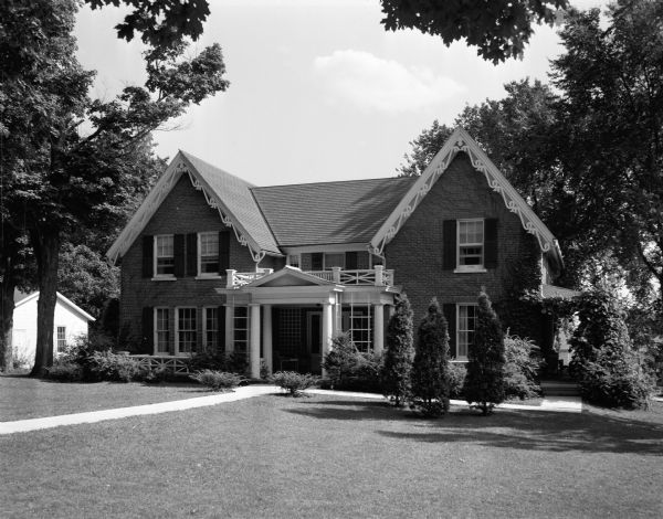 The Howe/Baxter House in Lancaster, owned by Mrs. and Mrs. W.C. Cartwright of Lancaster.  One wing was built during Civil War days for the Howe family. The rest was designed in 1914 by the Madison firm of Beatty and Strang for the Baxter family.