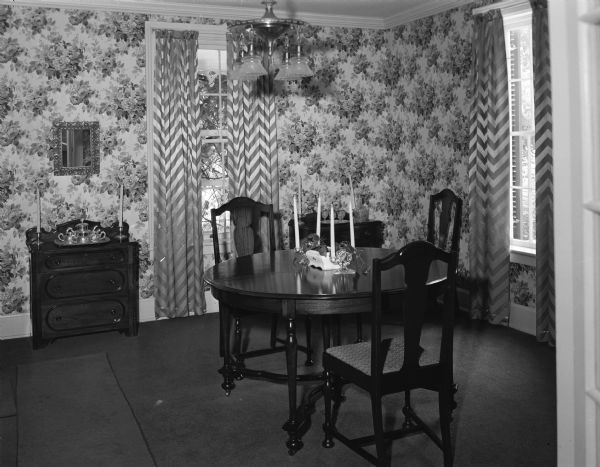 Dining room of Howe/Baxter House, owned by Mr. and Mrs. W.C. Cartwright of Lancaster. One wing was built during Civil War days for the Howe family. The rest was designed in 1914 by the Madison firm of Beatty and Strang for the Baxter family.