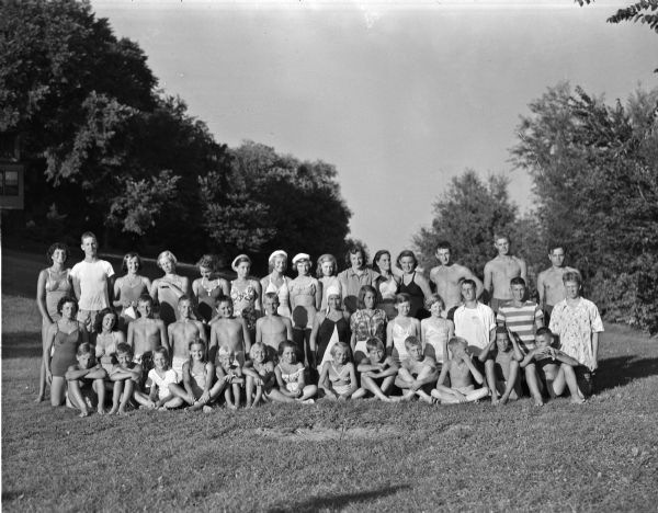 Outdoor group portrait of the 41 boys and girls who were winners of the individual events in the annual Madison swim meet held at B. B. Clark Beach.