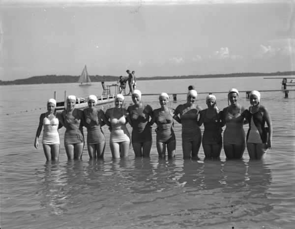 One of the features of the annual city swimming meet held at B.B. Clarke Beach was the water ballet put on by these girls: left to right, Sharon Thompson, Sharon Onstad, Sally Smith, Ginny Bowman, Lois Bakken, June Nlisalke, Nancy Zein, Shirley Haase, Beverly Kelleher, and Barbara Marshall.