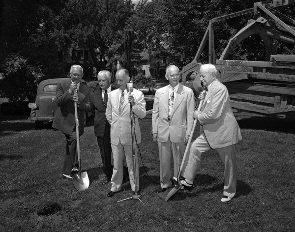 State and University of Wisconsin officials join in ground-breaking ceremonies for additions to the Wisconsin General hospital. left to right: Governor Oscar Rennebohm; Frank J. Sensenbrenner, Neenah, president of the university board of regents; Dr. H.M. Coon, superintendant of Wisconsin General; Dr. William S. Middleton, dean of the university medical school, and Ira M. Baldwin, vice-president of university academic affairs.