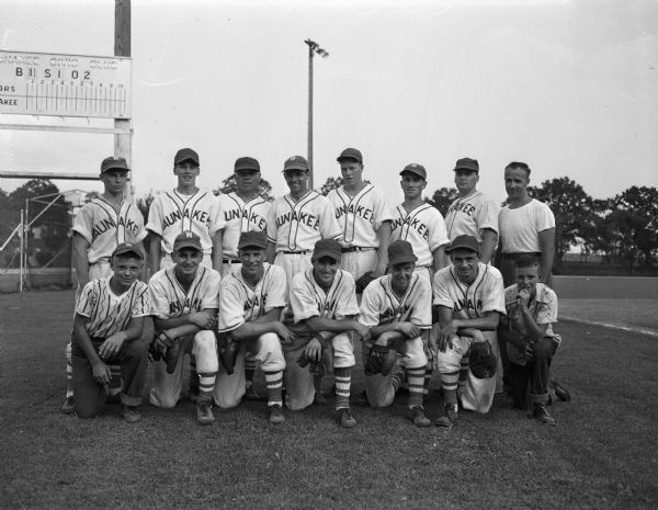 Group portrait of the Waunakee baseball team, who gained its eighth title in the Home Talent Baseball Leagues eleven years of operation by defeating Sun Prairie. Front row left to right: "Buck" Raemisch, batboy; Paul Bernards, Al Fleiner, Ed Murphy, Bob Kessenich, Don Kopp, and Bill Howard, batboy. Second row left to right: Vern Nesvacil, Bill Fleiner, Manager Ray Lambeley, Chuck Blakeslee, Bill Karls, Fritz Barbian, and Stan Cooper.