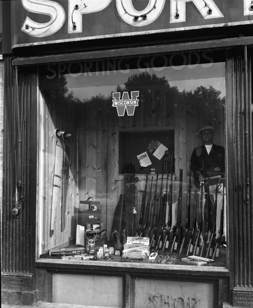 Display of guns in the display window at Wisconsin-Felton Sporting Goods Company, 29 West Main Street.