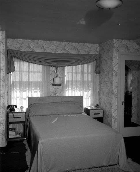 Master bedroom of the residence of Dr. and Mrs. Lewis (Isabella) Greene, 118 Lakewood Boulevard. The room is decorated in traditional style using the colors chartreuse, rose, and blue gray.