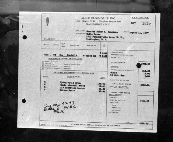 An automobile invoice and transfer documents hang in the window of a car purchased from Major General Harry Vaughan, an aide to President Harry S. Truman, by Miss Maurice Cavanaugh of Spring Green.