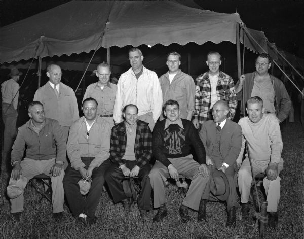 Heads of the various committees who planned the auction for the West Side Business Association are shown, left to right, front row: Emmett Bergenske, auction chairman; Roger Rosa, WSBMA president; R. W. "Bud" Martin, trucking chairman; Jim Pertzborn, chairman of the handling committee; J. Ray Bate, publicity, and Pat Lahiff, parking.  
Back row, left to right, are: L.J. Padgham, merchandise conditioning; Ben Trumbo, night policing; Freeman L. Fox, co-chairman of the auction; Harold Klipstein, ground maintenance and clean-up; Vern Geisler, finance and Irv Topp, electrical installations.
