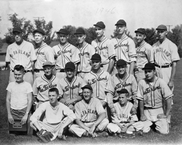 McFarland baseball team group portrait of players with coaches.