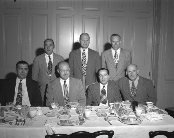 Members of the committee in charge of plans for the second annual reunion of the National "W" Club, to be held October 7 and 8 in Madison.
Left to right, front row, are: Charles Esser, product agent at the Gisholt Machine Company; John Hickman, assistant swimming coach and physical of education instructor at the University of Wisconsin; Bill Aspinwall, business manager of the Wisconsin athletic department; and Dr. Al Tormey, president of the Madison "W" Club.
Second row, left to right: Athletic Director Harry Stuhldreher; Riley Best, assistant track coach at the university; and Wally Mehl, assistant dean of the college of letters and science. 
The annual reunion will feature a noon luncheon at the Nakoma Golf Club, followed by the annual banquet at Nakoma that evening. Golf will be played at Nakoma during the afternoon. The final session of the annual reunion will be a noon luncheon in the field house on Saturday, Oct. 8, followed by the Wisconsin-California football game at Camp Randall.