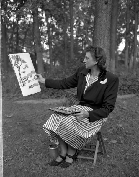 Madison Art Guild member Mrs. Oscar (Mary) Torgeson painting outdoors.