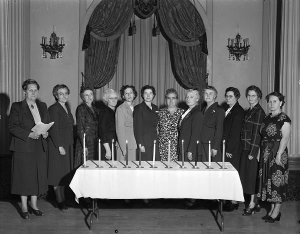 Group portrait of some of the leaders of the Women's Missionary Federation of the Evangelical Lutheran church attending a worker's meeting in Madison. The women were from Wisconsin, Michigan, and Illinois.