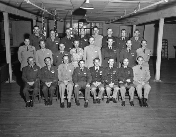 24 staff and command officers of the 184th Airborne reserve division posing for a group portrait during a regional conference.