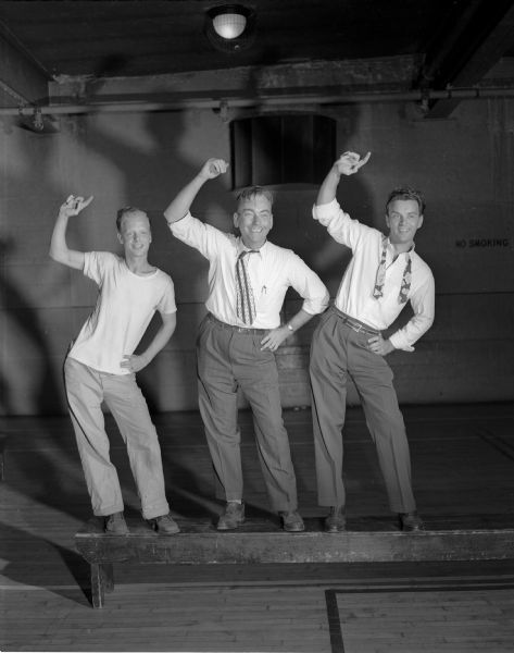 Pictured left to right are: John Putnam, 509 East Gorham Street; John Jenswold, 410 Ridge Street, and Bud Paunack, 317 Norris Court, practicing their musical number for the JCC musical revue "Then and Now". The three men will be part of a "bathing beauty" chorus that will do a song and dance routine to "By the Beautiful Sea".