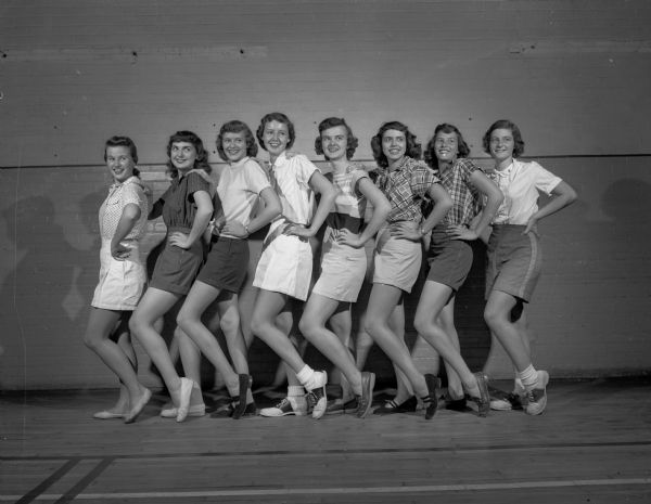 Madison high school girls practicing their chorus line routine for the JCC musical revue "Then and Now". Left to right: Susan Batiste, 3721 Odana Road; Sue Lentz, 2210 Hollister Avenue; Jeanne Caldwell, 4134 Cherokee Drive; Ellyn Ann Lathers. 716 Edgewood Avenue; Sandra Champion, 1022 Seminole Highway; Nancy Fay, 4121 Mandan Crescent; Pat Jefferson, 4109 Yuma Drive, and Jane Botham, 30 Old Shore Road.