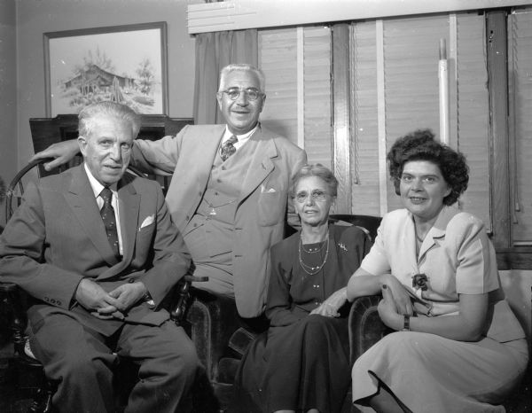 "Two distinguished visitors from Italy are pictured above with their Madison hosts. They are, left to right, Dr. Diego Spinelli, director-general of the Italian treasury; Anthony and Anna Sanna, 1230 Shorewood Boulevard. The host and hostess, and Dr. Frieda Parelli, Italian representative at the export-import bank in Washington."
