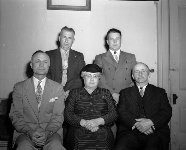 Five members of the Madison Division No. 32 of the Benefit Association of Railway Employees, who were awarded gold buttons for having been in the association for a quarter-century. Left to right: front row, Olaf Swennes, Madison; Ethel Newell, Madison; and George Weidenkopf, Baraboo. Standing are: B.R. Alford, Waunakee; and M.G. Shanks, Madison.