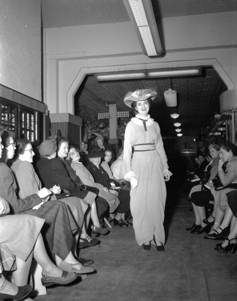 Carol Coyle models a 1914 dress and hat in Simpson's 40th Anniversary Style Show.