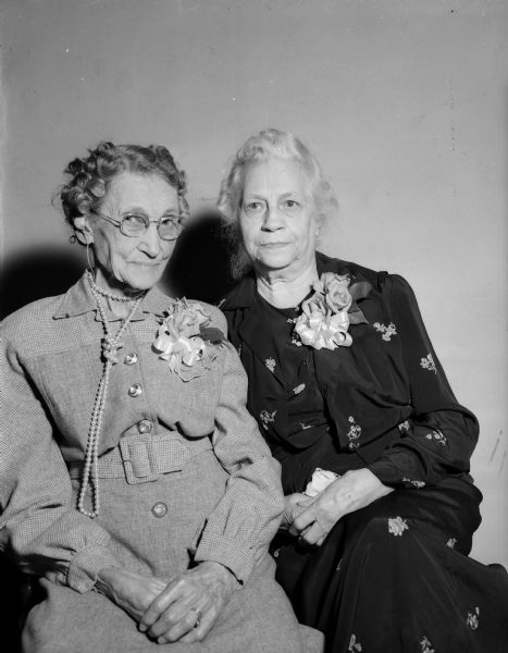 Two of the oldest members of the Women's Guild of Pilgrim Congregational Church, 953 Jenifer Street, are shown at a special party in their honor. On the left is Mrs. Effie Appleby, 1139 Rutledge St., who will be 90 on October 31st and, on the right is Mrs. H. O. (Amy) Bigelow, 1221 Spaight St., who was 90 on October 5th. 
The guild was organized as a sewing circle in Mrs. Appleby's home even before the founding of the Pilgrim church about 35 years ago.