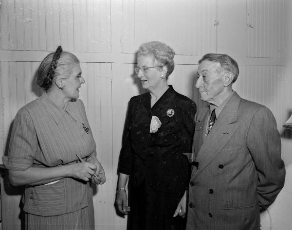 Three of the first staff members of the Oakwood Lutheran Home on Mineral Point Road stand side by side. Left to right: Mrs. A. Staehling, matron; Mrs. O.D. Grenwolt, head cook, and Mr. O.D. Grenwolt, maintenance man.